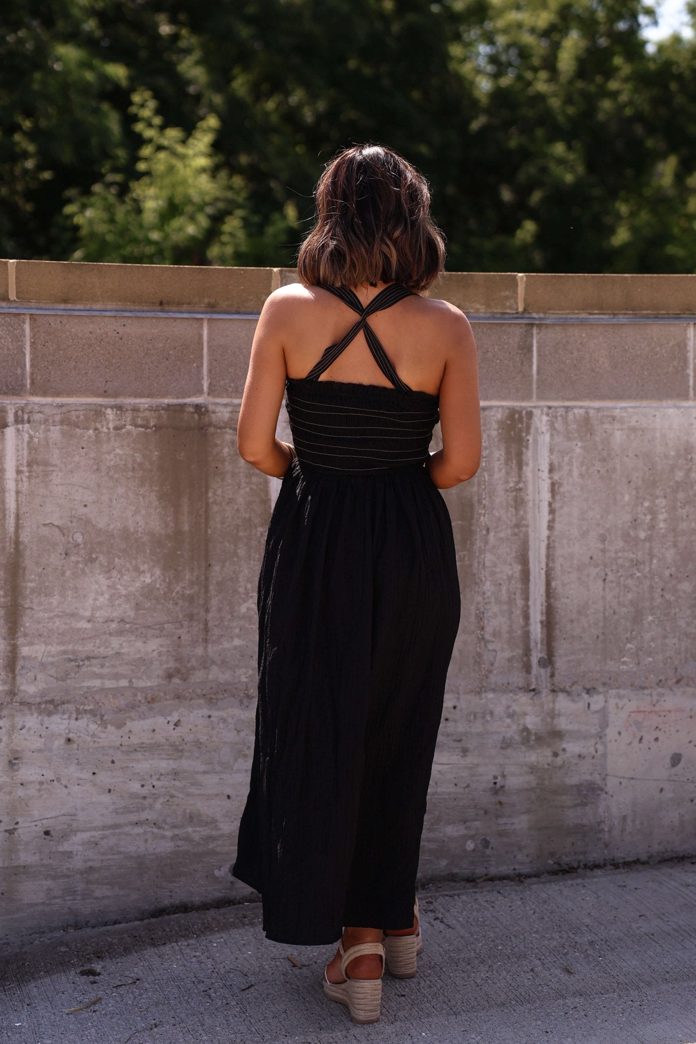 Back view black smocked maxi dress